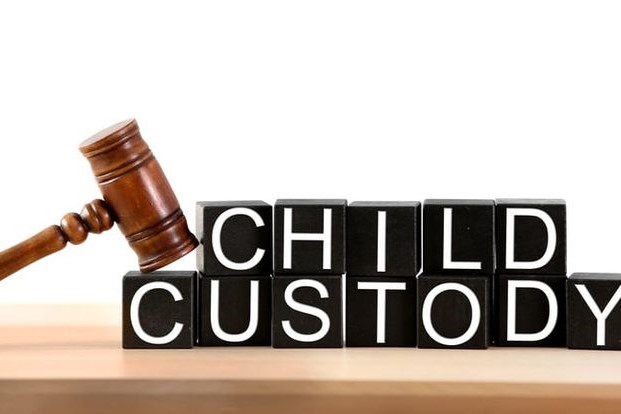 Child custody & Maintenance Pune - legal service concept image featuring a legal hammer and alphabet blocks representing children, symbolizing child custody rights, visitation matters, family court proceedings, and professional legal support by Advocate Archana Chikorde in Pune. Child custody and maintenance lawyer in Wakad Pune providing legal consultation