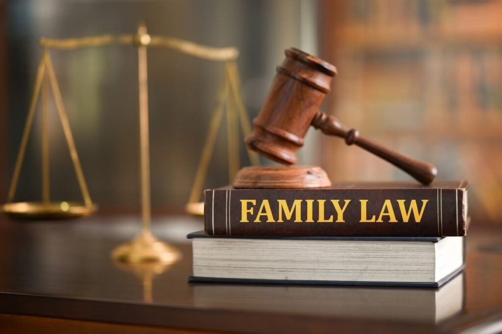 Family law services Pune concept image featuring a law book, justice balance scale, and legal hammer symbolizing professional legal assistance for family disputes, divorce matters, child custody, maintenance, and family court cases by Advocate Archana Chikorde in Pune